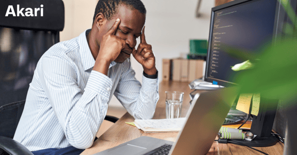 Programmer Stressed at Laptop coding