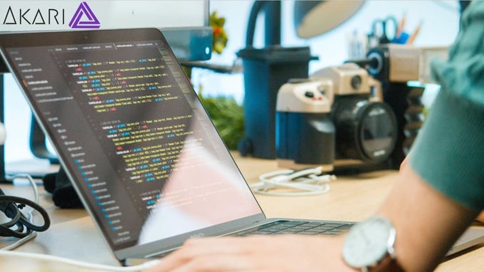 Person working on code on laptop