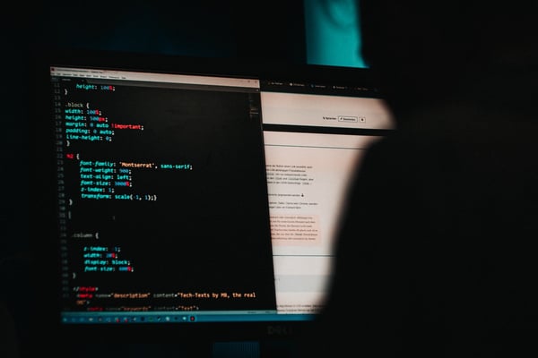 Hacker on laptop illustrating cyber security threats