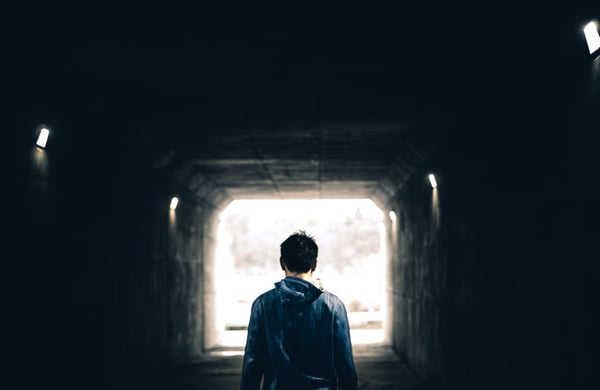 Man standing in tunnel